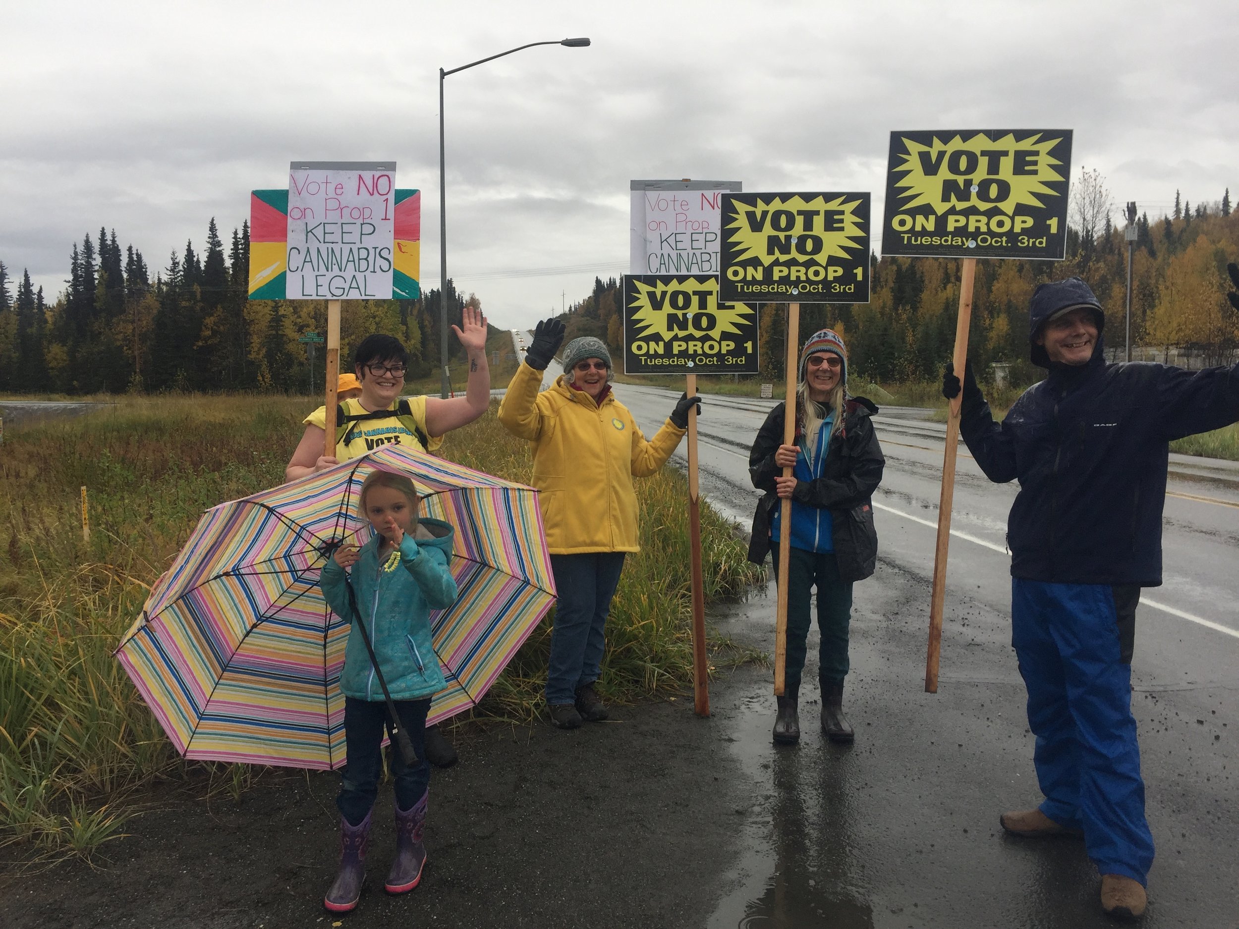 Chevelle and Art Abel, co-founders of Greatland Ganja sign wave with their family. If the ban vote goes through, the Abels would have to shutter the doors of their legal cannabis business.