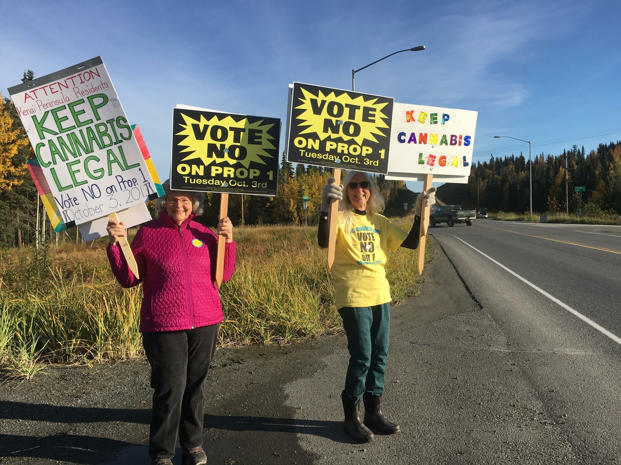 Jan Waldron and Ann Fraser sign waving in Kasilof.