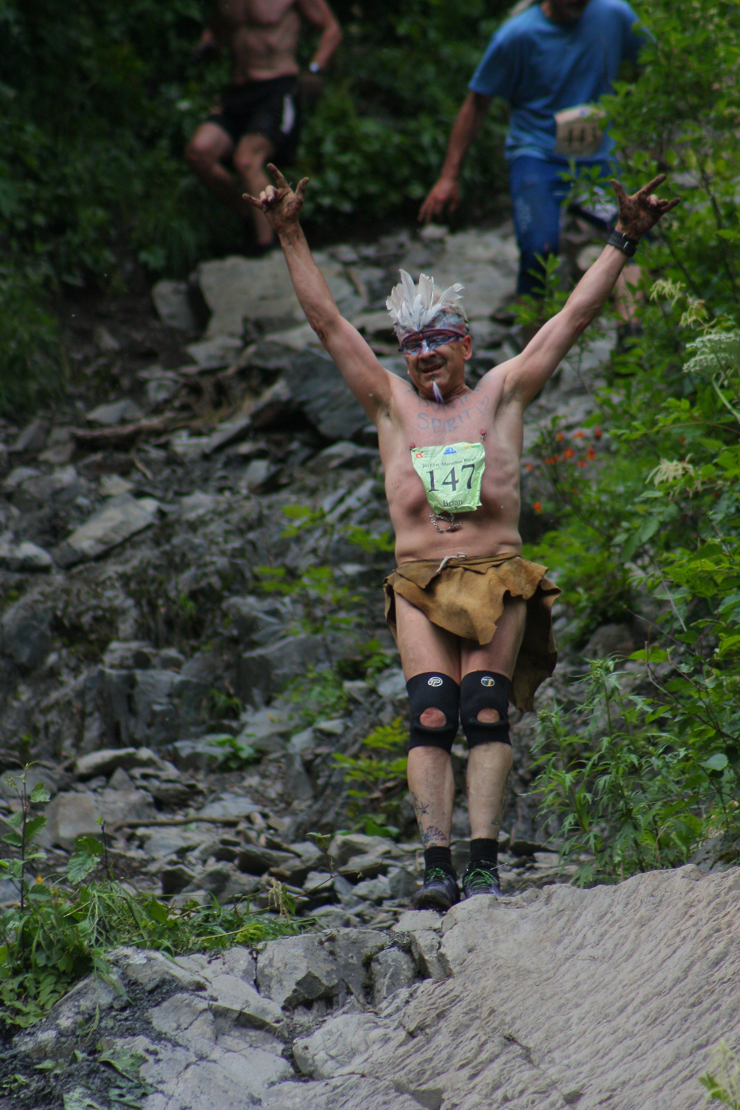 Anchorage mountain runner Brian Stoecker, known to many as ‘Birdman’, poses for the crowd in his characteristic loincloth and feather headpiece during the 2017 Mount Marathon Race.