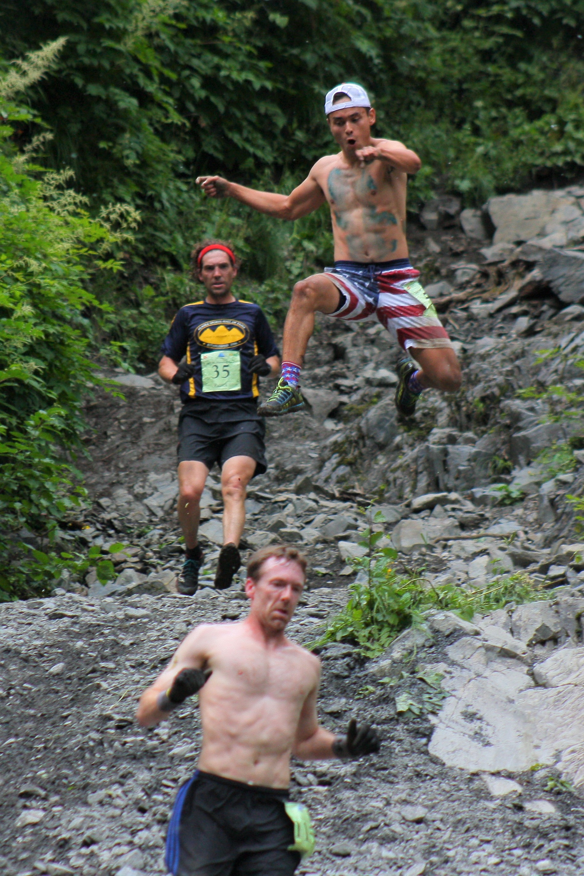 Tadhg Nakada leaps from ‘glory rock’ during the 2017 Mount Marathon Race on July 4. Nakada finished 38th in the men’s division, and was among the many participants who mug for the camera as they come off the mountain every year.